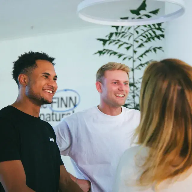 FINN colleagues chatting in the office